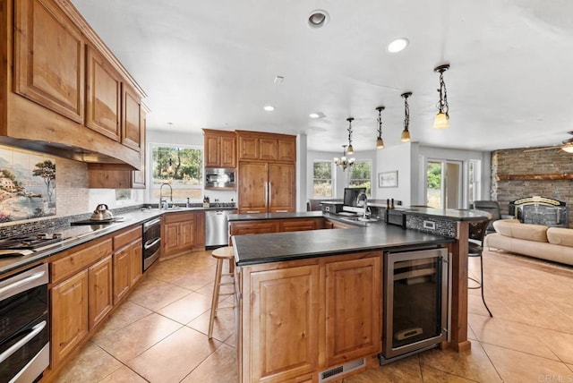 20202 Deerhorn Valley Rd, Jamul, CA 91935 - kitchen with wine cooler, plenty of natural light, a kitchen bar, and recessed lighting
