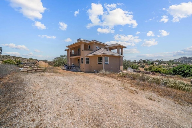20202 Deerhorn Valley Rd, Jamul, CA 91935 - view of front facade featuring stucco siding, a chimney, and a tile roof