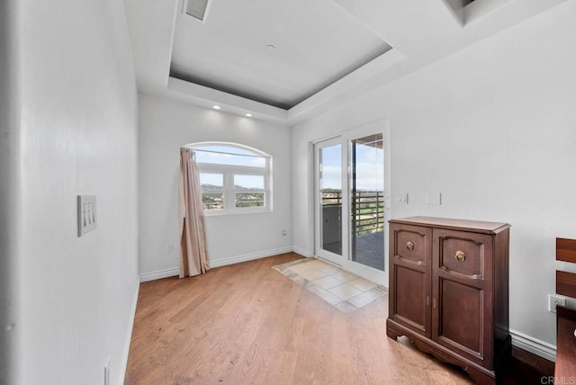 20202 Deerhorn Valley Rd, Jamul, CA 91935 - doorway with a raised ceiling, light wood finished floors, and recessed lighting