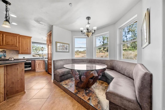 20202 Deerhorn Valley Rd, Jamul, CA 91935 - dining room with a chandelier, light tile patterned flooring, and recessed lighting