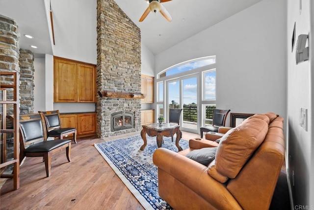 20202 Deerhorn Valley Rd, Jamul, CA 91935 - living area featuring a stone fireplace, high vaulted ceiling, a ceiling fan, light wood-style floors, and recessed lighting