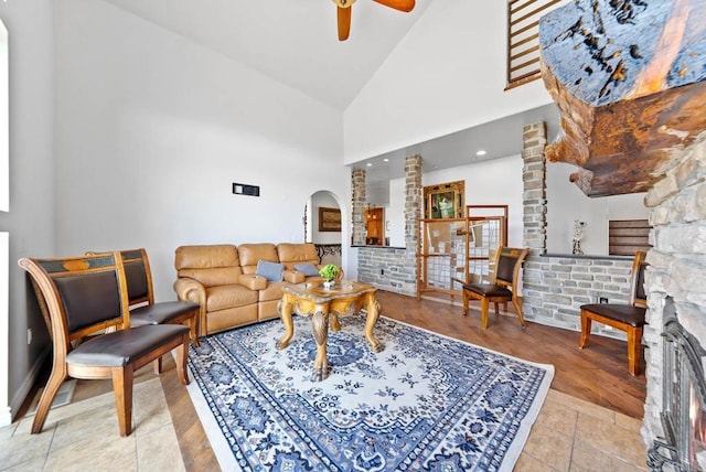 20202 Deerhorn Valley Rd, Jamul, CA 91935 - living area featuring ceiling fan, arched walkways, high vaulted ceiling, and light tile patterned floors