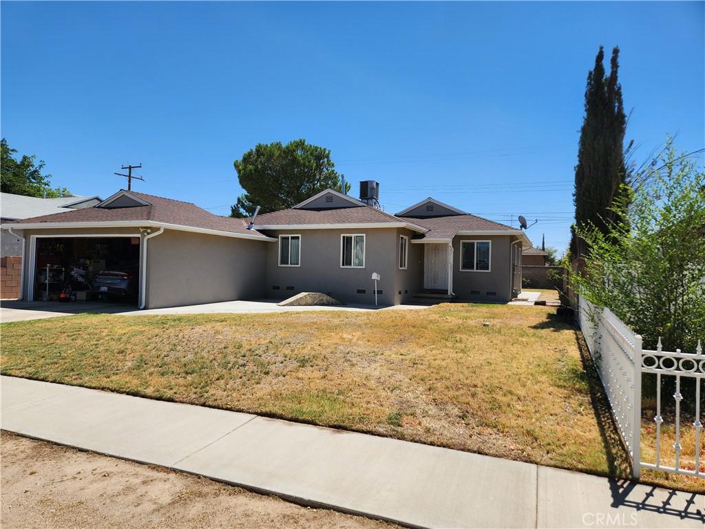 45532 Elm Ave, Lancaster, CA 93534 - ranch-style home with a garage, stucco siding, and driveway