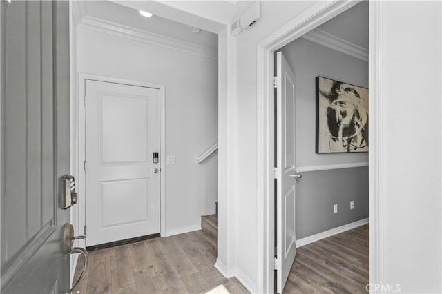 17557 Newland St Unit 101, Huntington Beach, CA 92647 - entrance foyer with crown molding, wood finished floors, and stairs