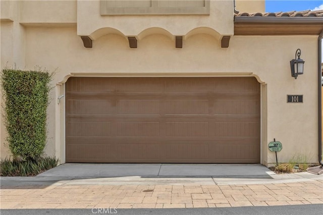 17557 Newland St Unit 101, Huntington Beach, CA 92647 - garage featuring driveway