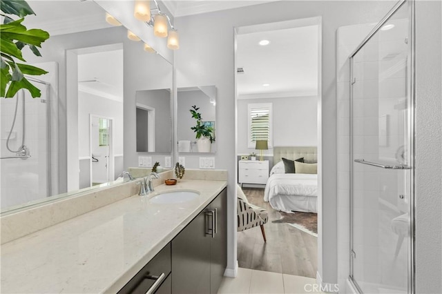 17557 Newland St Unit 101, Huntington Beach, CA 92647 - full bathroom with ornamental molding, vanity, a stall shower, ensuite bathroom, and wood finished floors