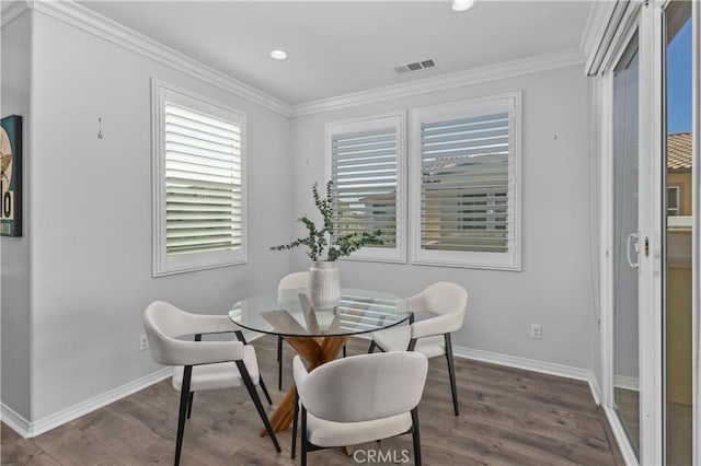 17557 Newland St Unit 101, Huntington Beach, CA 92647 - dining area featuring dark wood-style floors, ornamental molding, and recessed lighting