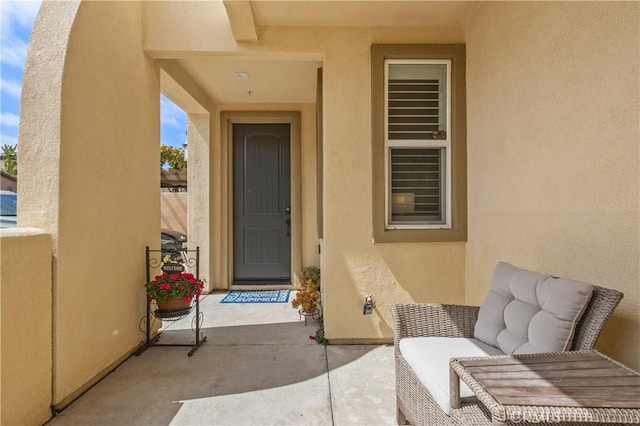 17557 Newland St Unit 101, Huntington Beach, CA 92647 - property entrance featuring stucco siding and a patio