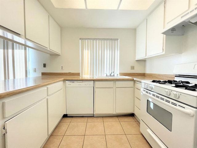 1249 Arcadia Ave, Vista, CA 92084 - kitchen with white appliances, under cabinet range hood, light countertops, and light tile patterned floors