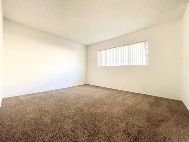 1249 Arcadia Ave, Vista, CA 92084 - carpeted empty room featuring a textured ceiling