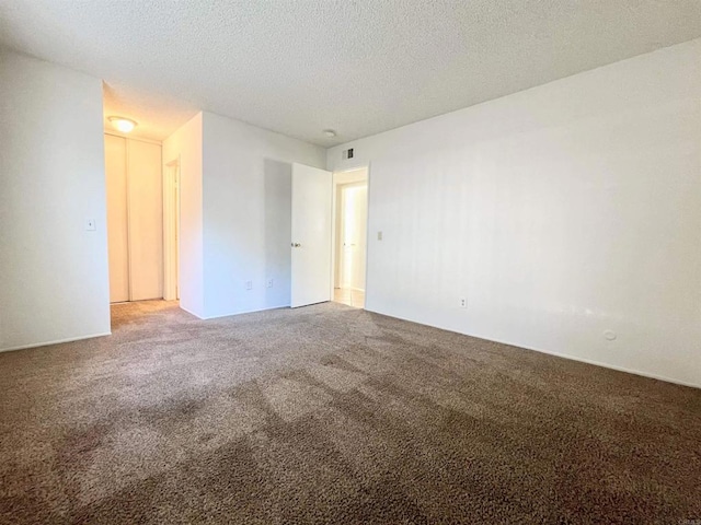 1249 Arcadia Ave, Vista, CA 92084 - carpeted empty room featuring a textured ceiling