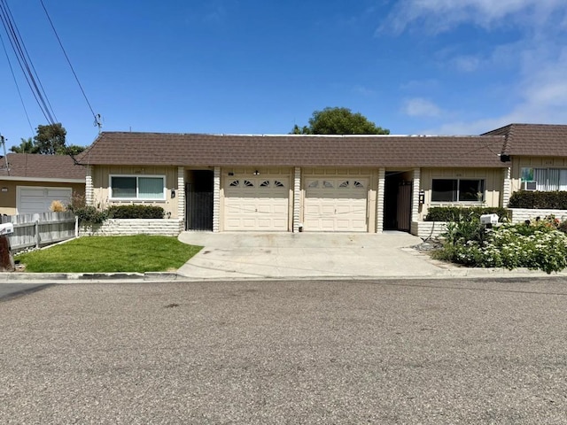 60814 Garfield St, Oceanside, CA 92054 - ranch-style home featuring an attached garage, driveway, mansard roof, and a tiled roof