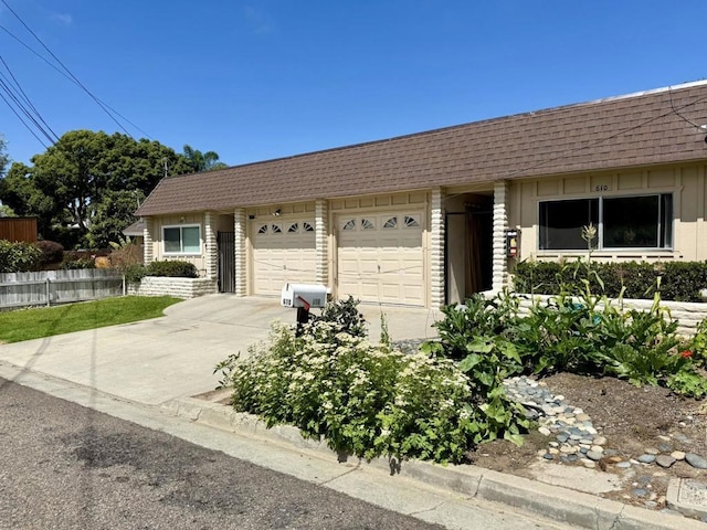 60814 Garfield St, Oceanside, CA 92054 - single story home with driveway, an attached garage, mansard roof, and roof with shingles