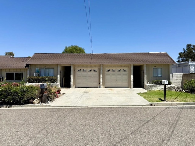 60814 Garfield St, Oceanside, CA 92054 - ranch-style house featuring an attached garage, driveway, and mansard roof