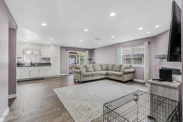 118 Everest St, Oxnard, CA 93030 - living area featuring dark wood finished floors, plenty of natural light, and recessed lighting