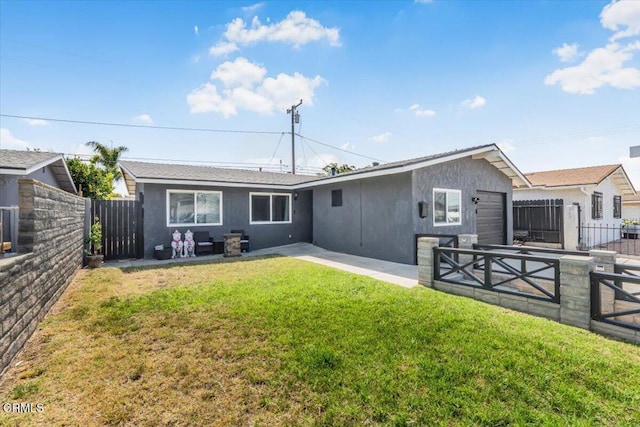 118 Everest St, Oxnard, CA 93030 - back of property with stucco siding, a fenced backyard, an attached garage, and a patio area
