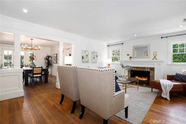 802 S Arroyo Blvd, Pasadena, CA 91105 - living room featuring dark wood-style flooring, ornamental molding, a tiled fireplace, a chandelier, and recessed lighting