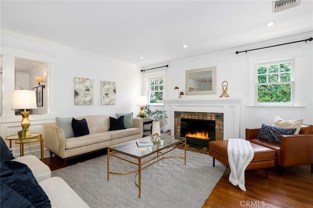 802 S Arroyo Blvd, Pasadena, CA 91105 - living area featuring wood finished floors, ornamental molding, a tiled fireplace, and recessed lighting