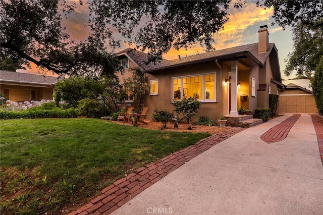 802 S Arroyo Blvd, Pasadena, CA 91105 - view of front of house featuring stucco siding, a chimney, a garage, and concrete driveway
