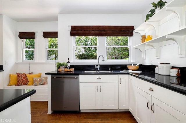 802 S Arroyo Blvd, Pasadena, CA 91105 - kitchen with plenty of natural light, stainless steel dishwasher, dark countertops, and white cabinetry