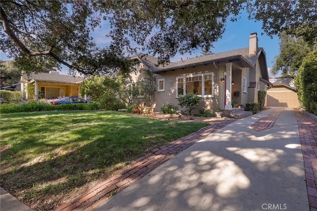 802 S Arroyo Blvd, Pasadena, CA 91105 - view of front facade with a front lawn, stucco siding, a chimney, and concrete driveway