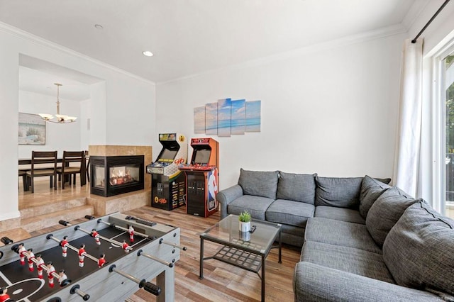 432 S Cleveland St, Oceanside, CA 92054 - living area with a chandelier, wood finished floors, ornamental molding, recessed lighting, and a multi sided fireplace