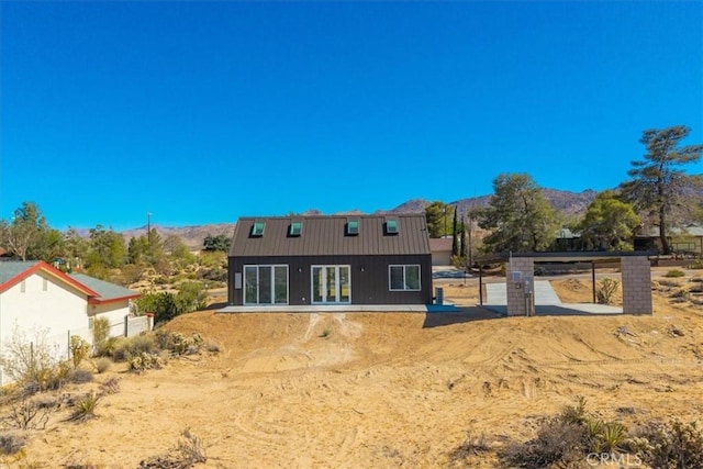 61850 Alta Mura Dr, Joshua Tree, CA 92252 - back of property featuring a mountain view and french doors
