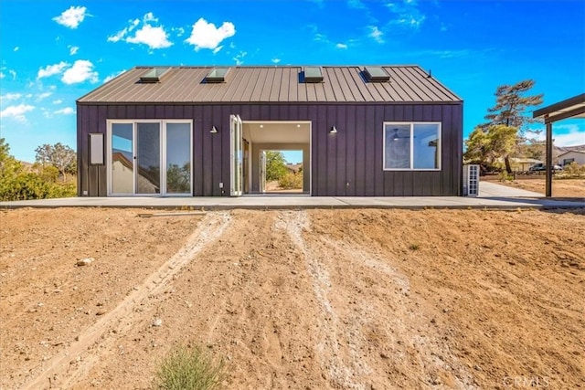 61850 Alta Mura Dr, Joshua Tree, CA 92252 - back of house with a standing seam roof, board and batten siding, and a metal roof
