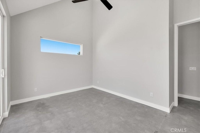 61850 Alta Mura Dr, Joshua Tree, CA 92252 - unfurnished bedroom featuring finished concrete flooring, lofted ceiling, and a ceiling fan
