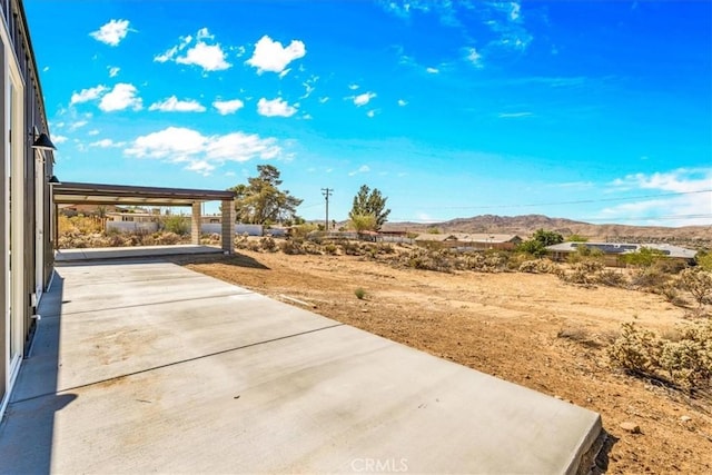 61850 Alta Mura Dr, Joshua Tree, CA 92252 - view of yard featuring a patio area and a mountain view
