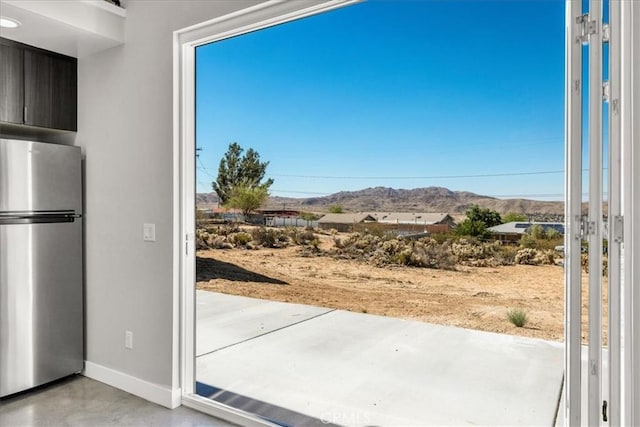 61850 Alta Mura Dr, Joshua Tree, CA 92252 - doorway to outside with a mountain view and baseboards