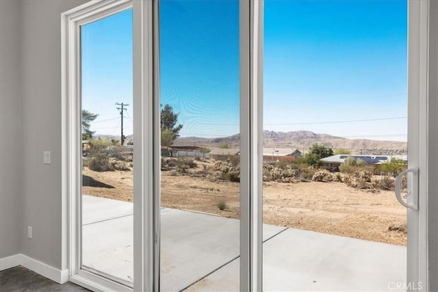61850 Alta Mura Dr, Joshua Tree, CA 92252 - doorway with a mountain view and baseboards