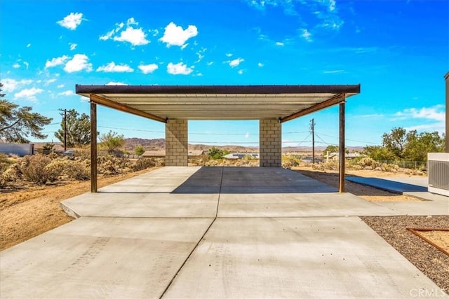 61850 Alta Mura Dr, Joshua Tree, CA 92252 - view of patio / terrace featuring driveway and a carport