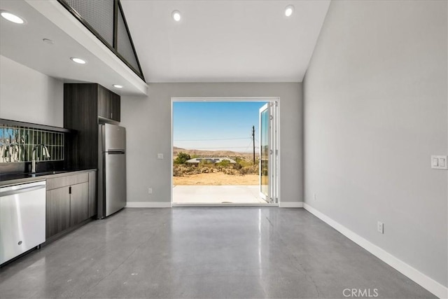 61850 Alta Mura Dr, Joshua Tree, CA 92252 - unfurnished living room with finished concrete flooring, recessed lighting, and vaulted ceiling