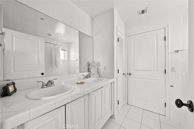 50802 280th St W, Lancaster, CA 93536 - full bathroom with double vanity, tile patterned floors, and a closet