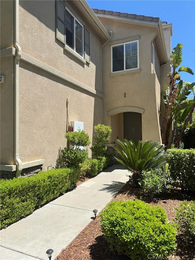 24112 Joshua Dr, Valencia, CA 91354 - view of front facade featuring stucco siding