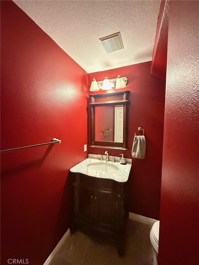 24112 Joshua Dr, Valencia, CA 91354 - half bath featuring vanity and a textured ceiling