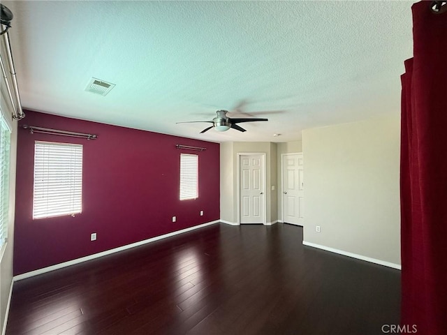 24112 Joshua Dr, Valencia, CA 91354 - spare room with a ceiling fan, plenty of natural light, dark wood-style floors, and a textured ceiling