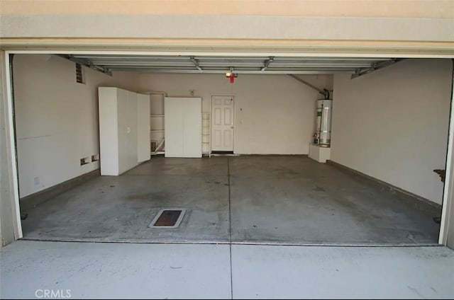 24112 Joshua Dr, Valencia, CA 91354 - garage featuring secured water heater