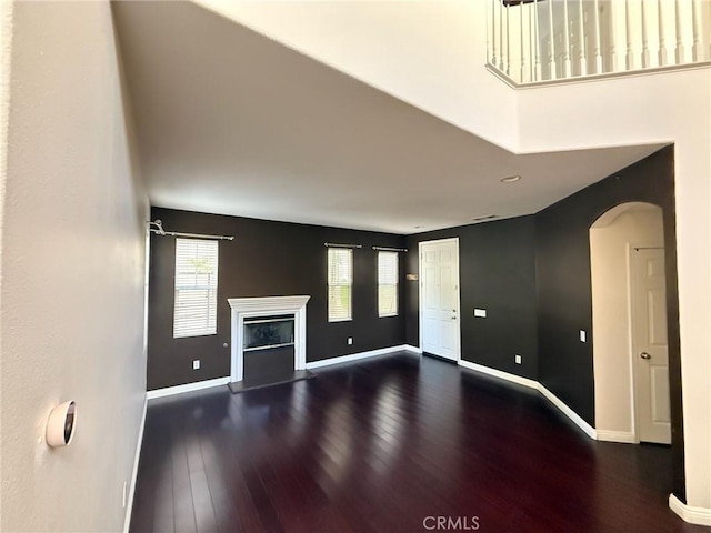 24112 Joshua Dr, Valencia, CA 91354 - unfurnished living room featuring wood finished floors, plenty of natural light, arched walkways, and recessed lighting