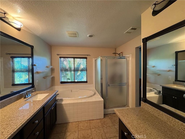24112 Joshua Dr, Valencia, CA 91354 - full bathroom with healthy amount of natural light, two vanities, a stall shower, a bath, and a textured ceiling