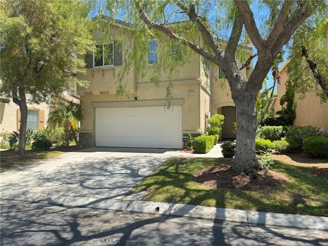 24112 Joshua Dr, Valencia, CA 91354 - view of front of house featuring stucco siding, concrete driveway, and a garage