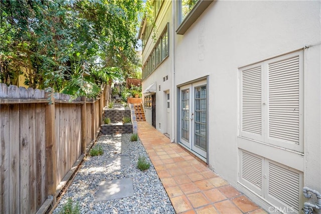 2511 W 5th St, Los Angeles, CA 90057 - view of property exterior with stucco siding, french doors, and a patio