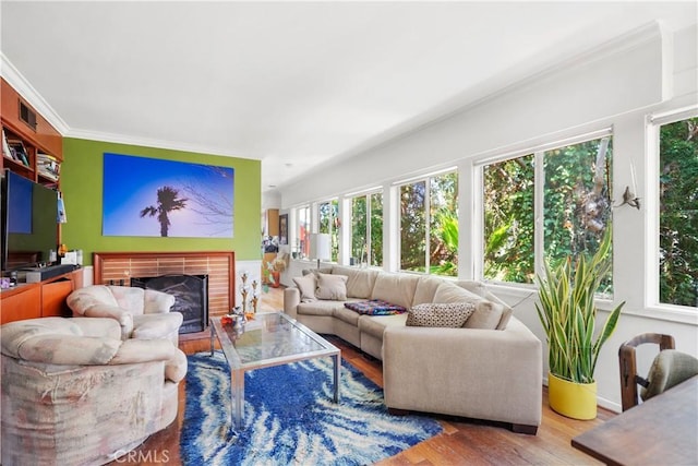 2511 W 5th St, Los Angeles, CA 90057 - living area with wood finished floors, a brick fireplace, and ornamental molding