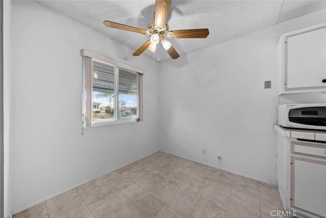 3648 Mira Pacific Dr, Oceanside, CA 92056 - unfurnished dining area featuring a ceiling fan and a textured ceiling