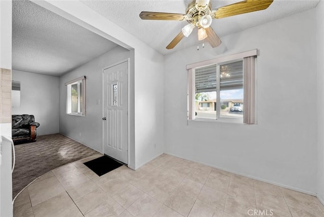3648 Mira Pacific Dr, Oceanside, CA 92056 - entrance foyer with a textured ceiling, ceiling fan, and light tile patterned floors