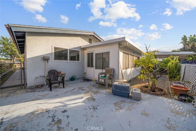3648 Mira Pacific Dr, Oceanside, CA 92056 - back of house featuring stucco siding and a patio area