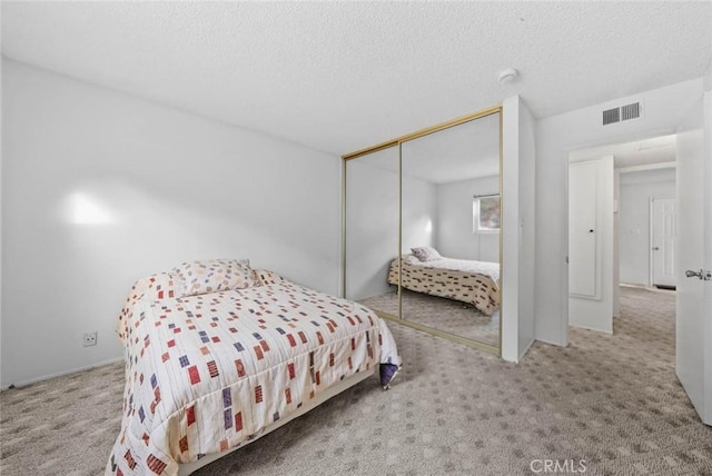 3648 Mira Pacific Dr, Oceanside, CA 92056 - carpeted bedroom with a closet and a textured ceiling