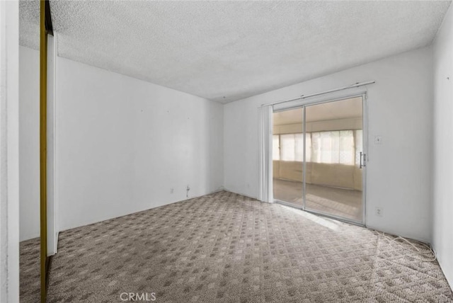 3648 Mira Pacific Dr, Oceanside, CA 92056 - spare room featuring carpet and a textured ceiling