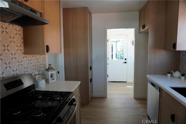 3565 Lashbrook Ave, Rosemead, CA 91770 - kitchen with stainless steel appliances, under cabinet range hood, light wood-style flooring, and light countertops